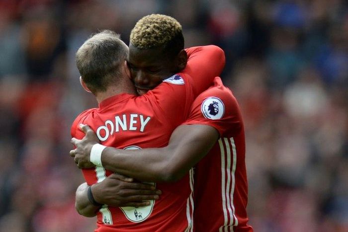 Manchester United's midfielder Paul Pogba (R) embraces striker Wayne Rooney after scoring against Cyrstal Palace on May 21, 2017