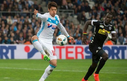 Olympique de Marseille's Japanese defender Hiroki Sakai (L) has won over hearts and minds in France where he is seen as an ambassador of his homeland