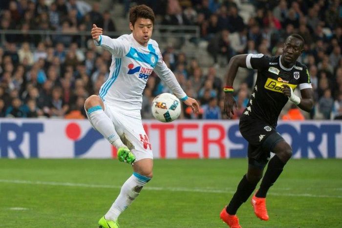 Olympique de Marseille's Japanese defender Hiroki Sakai (L) has won over hearts and minds in France where he is seen as an ambassador of his homeland