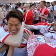 VfB Stuttgart's forward Takuma Asano (C) is celebrated by fans after the German second division team was promoted to the Bundesliga on May 21, 2017