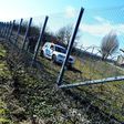 Local police officials patrol in front of a part of the border fence of the Hungarian-Croatian border at the Beremend border crossing point on February 23, 2017