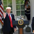 The head of the Environmental Protection Agency Scott Pruitt (R) and US President Donald Trump speak to the media in the Rose Garden of the White House