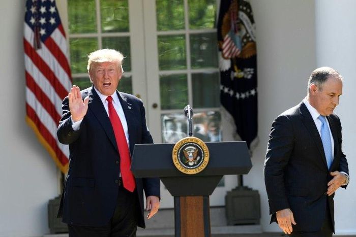 The head of the Environmental Protection Agency Scott Pruitt (R) and US President Donald Trump speak to the media in the Rose Garden of the White House