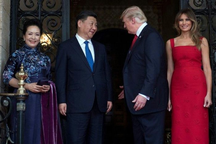 US First Lady Melania Trump and US President Donald Trump welcome Chinese President Xi Jinping and his wife Peng Liyuan to the Mar-a-Lago estate in West Palm Beach, Florida