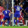 Leicester City's striker Jamie Vardy (C) scores during the UEFA Champions League quarter-final second leg football match between Leicester City and Club Atletico de Madrid at the King Power stadium in Leicester on April 18, 2017