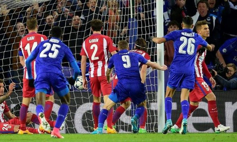 Leicester City's striker Jamie Vardy (C) scores during the UEFA Champions League quarter-final second leg football match between Leicester City and Club Atletico de Madrid at the King Power stadium in Leicester on April 18, 2017