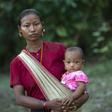 A displaced woman carries her child at a Buddhist monastery in Rakhine state near the Bangladesh border