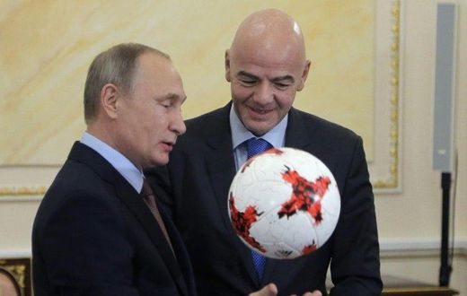 Russian President Vladimir Putin chats with FIFA president Gianni Infantino at the Kremlin in Moscow, on November 25, 2016