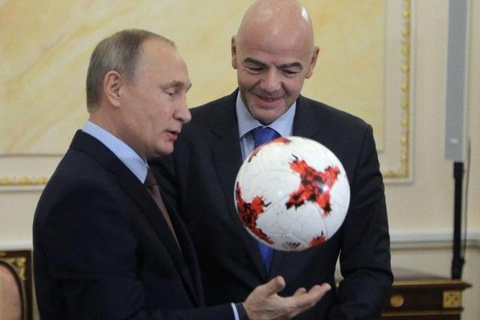 Russian President Vladimir Putin chats with FIFA president Gianni Infantino at the Kremlin in Moscow, on November 25, 2016