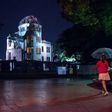 A pedestrian walks past the Hiroshima Peace Memorial Genbaku Dome on May 24, 2016