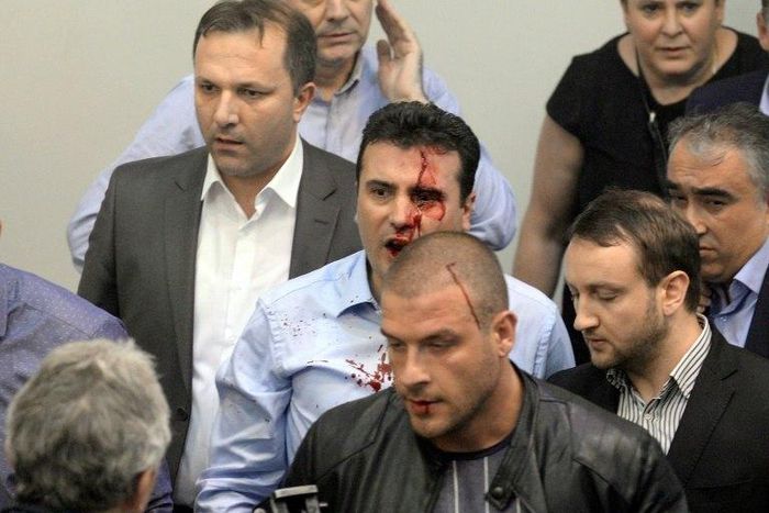 Opposition Social Democrats leader Zoran Zaev bleeding after being injured when supporters of Macedonia's former leading party entered the parliament and attacked MPs