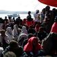 Migrants arrive in Vibo Marina, after a rescue operation in the Mediterranean Sea during which nine people drowned, ten were missing and nearly 1000 were rescued