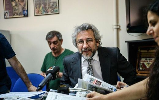 Cumhuriyet Daily newspaper Editor-in-chief Can Dundar (C), pictured during a meeting in 2016, was handed a five-year-and-10-month jail term and has now fled Turkey for Germany