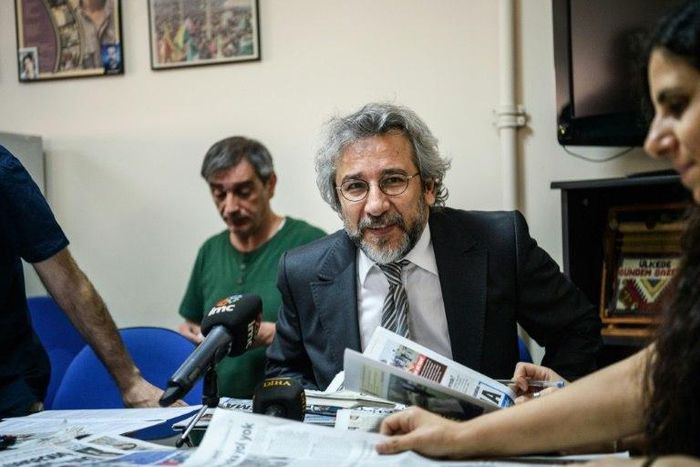 Cumhuriyet Daily newspaper Editor-in-chief Can Dundar (C), pictured during a meeting in 2016, was handed a five-year-and-10-month jail term and has now fled Turkey for Germany