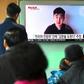 South Koreans watch a TV broadcast showing video footage of a man who claims to be Kim Han-Sol, a nephew of North Korea's leader Kim Jong-Un, at a railway station in Seoul, on March 8, 2017