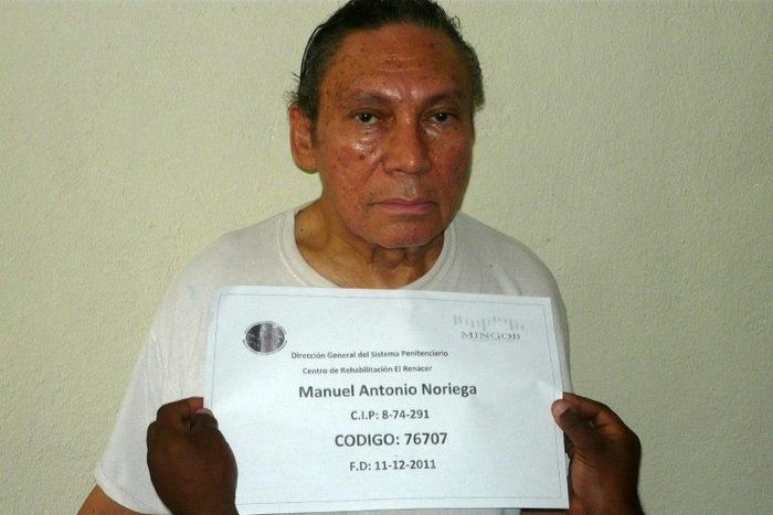 This handout file picture taken on December 14, 2011 shows Panamanian former dictator Manuel Noriega having his mug shot being taken at the El Renacer penitentiary, 25 km southeast of Panama City