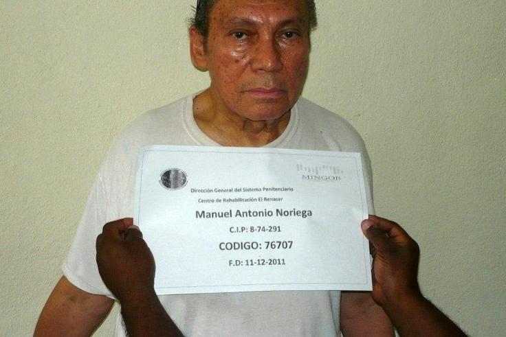 This handout file picture taken on December 14, 2011 shows Panamanian former dictator Manuel Noriega having his mug shot being taken at the El Renacer penitentiary, 25 km southeast of Panama City