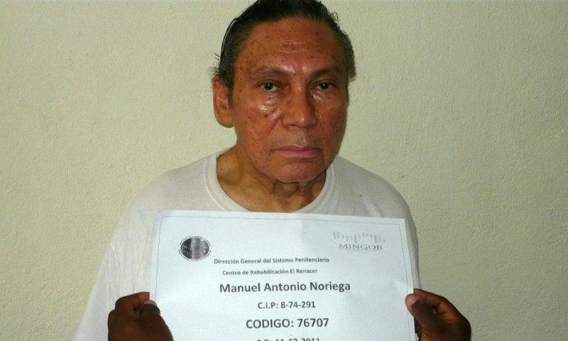 This handout file picture taken on December 14, 2011 shows Panamanian former dictator Manuel Noriega having his mug shot being taken at the El Renacer penitentiary, 25 km southeast of Panama City