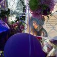 Mementos left by fans are attached to the fence surrounding Paisley Park, the home and studio of Prince, in this April 2016 file photo