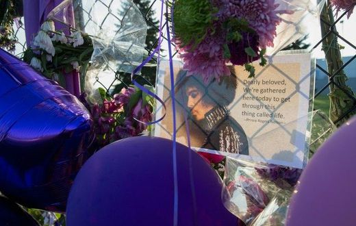 Mementos left by fans are attached to the fence surrounding Paisley Park, the home and studio of Prince, in this April 2016 file photo