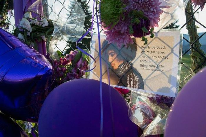 Mementos left by fans are attached to the fence surrounding Paisley Park, the home and studio of Prince, in this April 2016 file photo