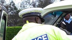 A traffic police officer inspects a matatu Police Constable Abel Musati arrested for shooting at Traffic Officer Hillary Korir using his AK-47 rifle