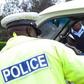 A traffic police officer inspects a matatu