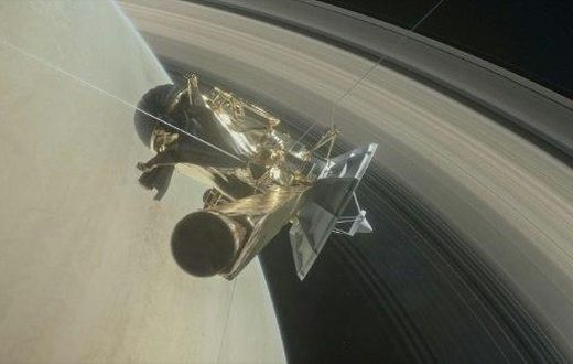 This NASA handout image depicts the Cassini unmanned spacecraft above Saturn's rings