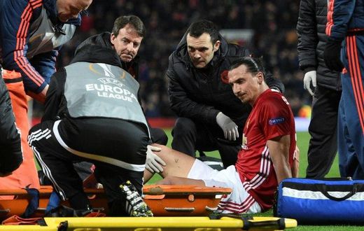 Manchester United's striker Zlatan Ibrahimovic gets treatment after injuring his knee on April 20, 2017