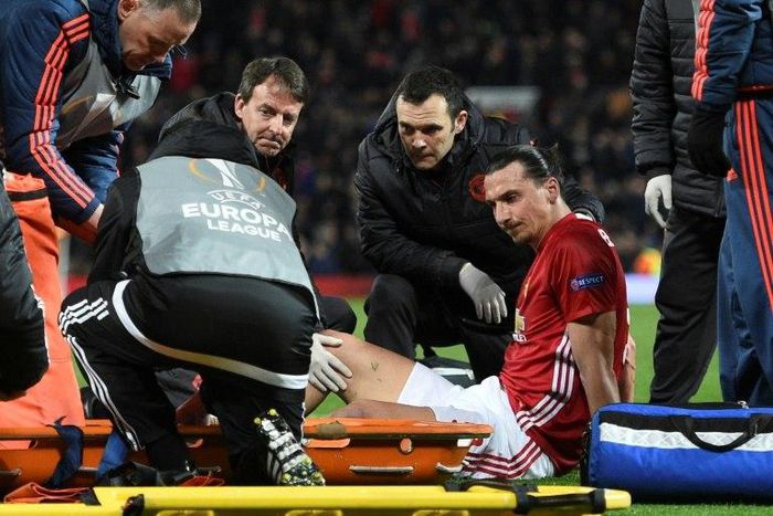 Manchester United's striker Zlatan Ibrahimovic gets treatment after injuring his knee on April 20, 2017