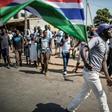 A man waves a Gambian flag while he celebrates the victory of Gambia's opposition candidate Adama Barrow during the Presidential Elections on December 2, 2016, in Serekunda, Banjul