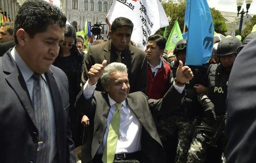 Ecuador's President-elect Lenin Moreno (C) greets supporters at the Plaza Grande in Quito on April 3, 2017