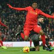 Liverpool striker Divock Origi (centre) is tackled by Southampton's Jack Stephens during their EFL Cup semi-final match between at Anfield in Liverpool on January 25, 2017