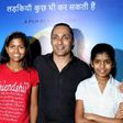 Indian mountaineer Poorna Malavath (L) and actress Aditi Inamdar (R) attend the screening of upcoming Hindi film ‘Poorna’ directed by Rahul Bose (C) in Mumbai on March 27, 2017