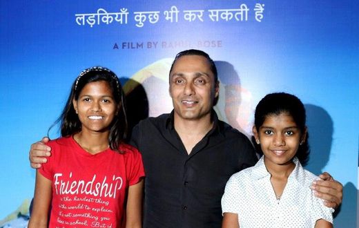 Indian mountaineer Poorna Malavath (L) and actress Aditi Inamdar (R) attend the screening of upcoming Hindi film ‘Poorna’ directed by Rahul Bose (C) in Mumbai on March 27, 2017
