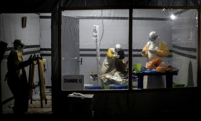 Health workers treat an unconfirmed Ebola patient inside a Doctors Without Borders-supported Ebola Treatment Center in east Democratic Republic of Congo, where the aid organization has suspended non-essential work after gunmen abducted two of its local...