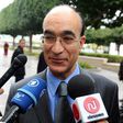 Tunisian then-Defence Minister Ridha Grira speaks to the press upon arrival to attend the first ministers session, on January 20, 2011 in the government palace in Tunis
