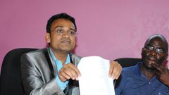 Taj Mall owner Ramesh Gorasia and Jeff Ambundo, a tenant, address the press on October 8, 2015.