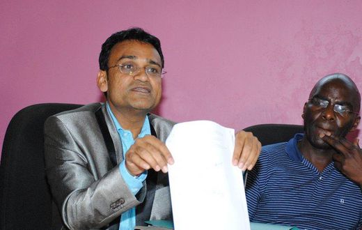 Taj Mall owner Ramesh Gorasia and Jeff Ambundo, a tenant, address the press on October 8, 2015.