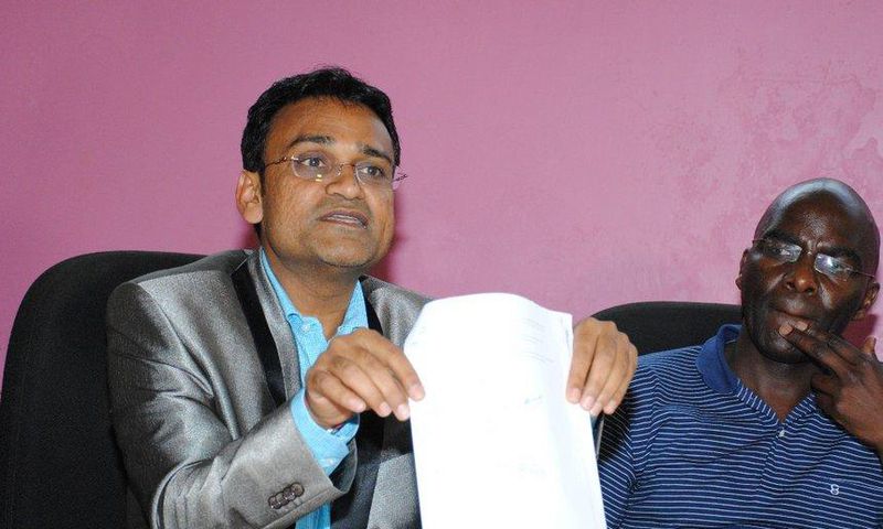 Taj Mall owner Ramesh Gorasia and Jeff Ambundo, a tenant, address the press on October 8, 2015.