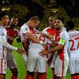 Monaco's players celebrate scoring during their UEFA Champions League 1st leg quarter-final football match against Dortmund, western Germany on April 12, 2017