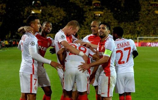 Monaco's players celebrate scoring during their UEFA Champions League 1st leg quarter-final football match against Dortmund, western Germany on April 12, 2017