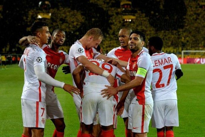 Monaco's players celebrate scoring during their UEFA Champions League 1st leg quarter-final football match against Dortmund, western Germany on April 12, 2017
