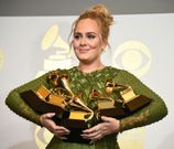 Adele holds five Grammy trophies, including the top two awards of the night, Album and Record of the Year for her blockbuster hit "Hello" and the album "25"