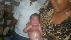 Juliet Chime with the rescued baby