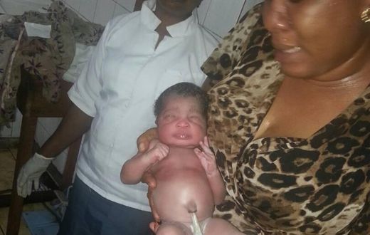 Juliet Chime with the rescued baby