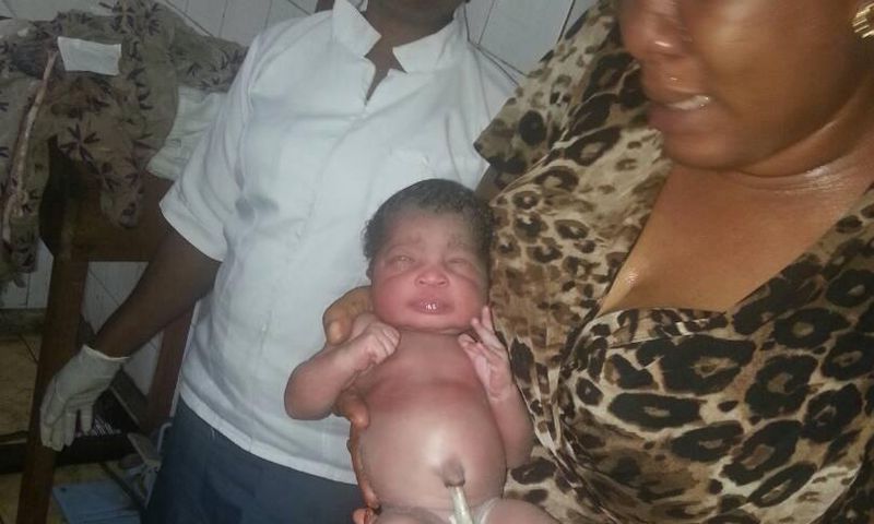 Juliet Chime with the rescued baby