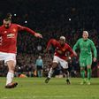 Manchester United's striker Zlatan Ibrahimovic shoots from the penalty spot to score his team's third goal during the UEFA Europa League Round of 32 first-leg football match against and Saint-Etienne at Old Trafford stadium on February 16, 2017