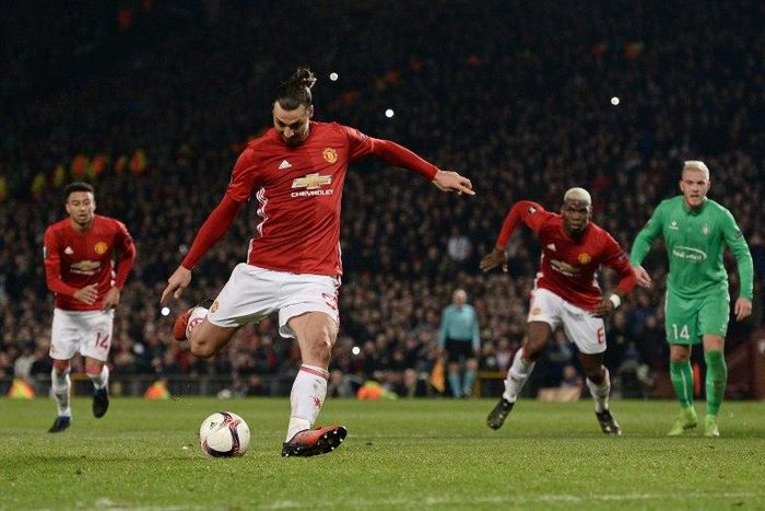 Manchester United's striker Zlatan Ibrahimovic shoots from the penalty spot to score his team's third goal during the UEFA Europa League Round of 32 first-leg football match against and Saint-Etienne at Old Trafford stadium on February 16, 2017