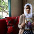 Manal al-Saayed, the mother of Israeli citizen Hisham al-Sayed, holds a picture of her son who is believed to have been held by Hamas since April 2015